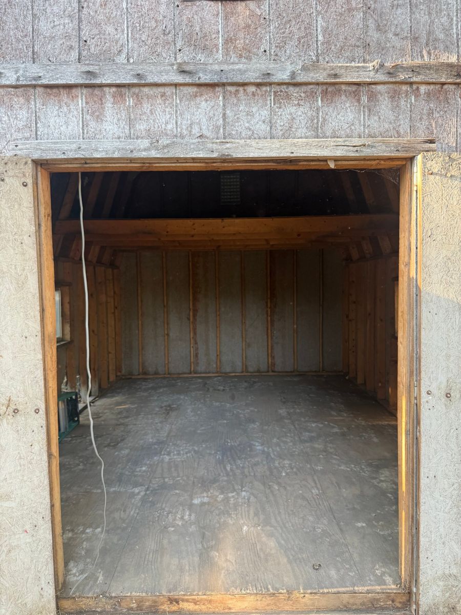 Barn cleanout after: the same barn emptied and swept